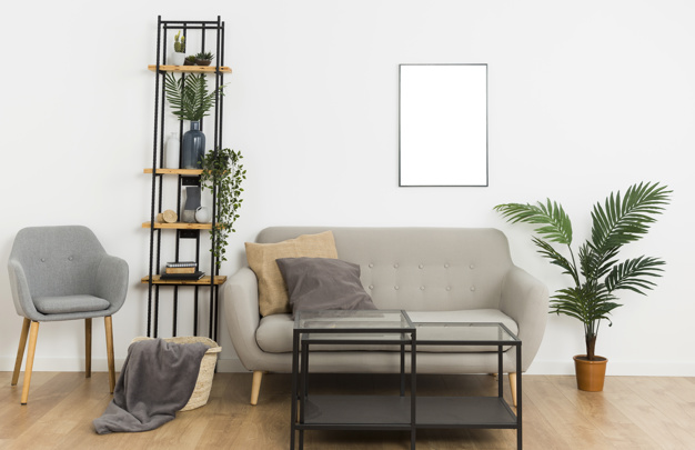 Plants with empty frame and sofa Free Photo